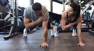 Toning Bingo Wings: Your Ultimate Guide to Sculpting Sleek Arms at the Gym 3 Fitness trainer demonstrating arm toning exercises Northampton