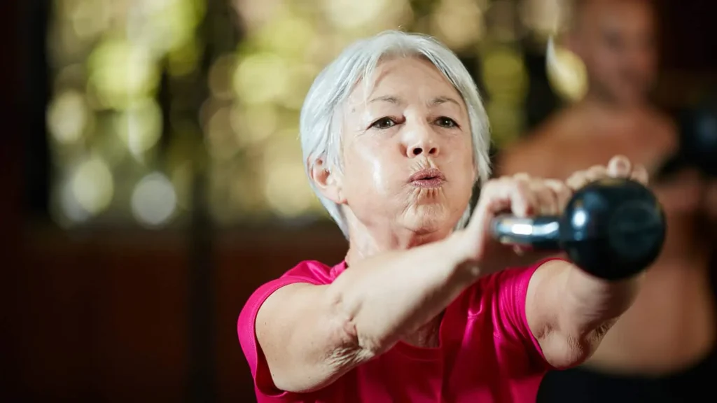 Toning Bingo Wings: Effective Exercises and Tips for Achieving Sleeker Arms 2 Person performing arm exercises with dumbbells Northampton